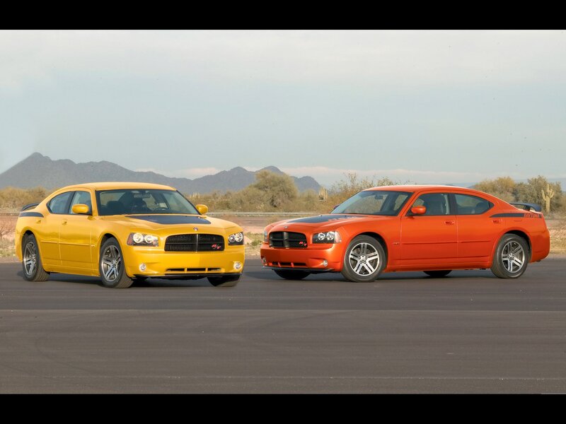 Two Dodge Chargers on a track