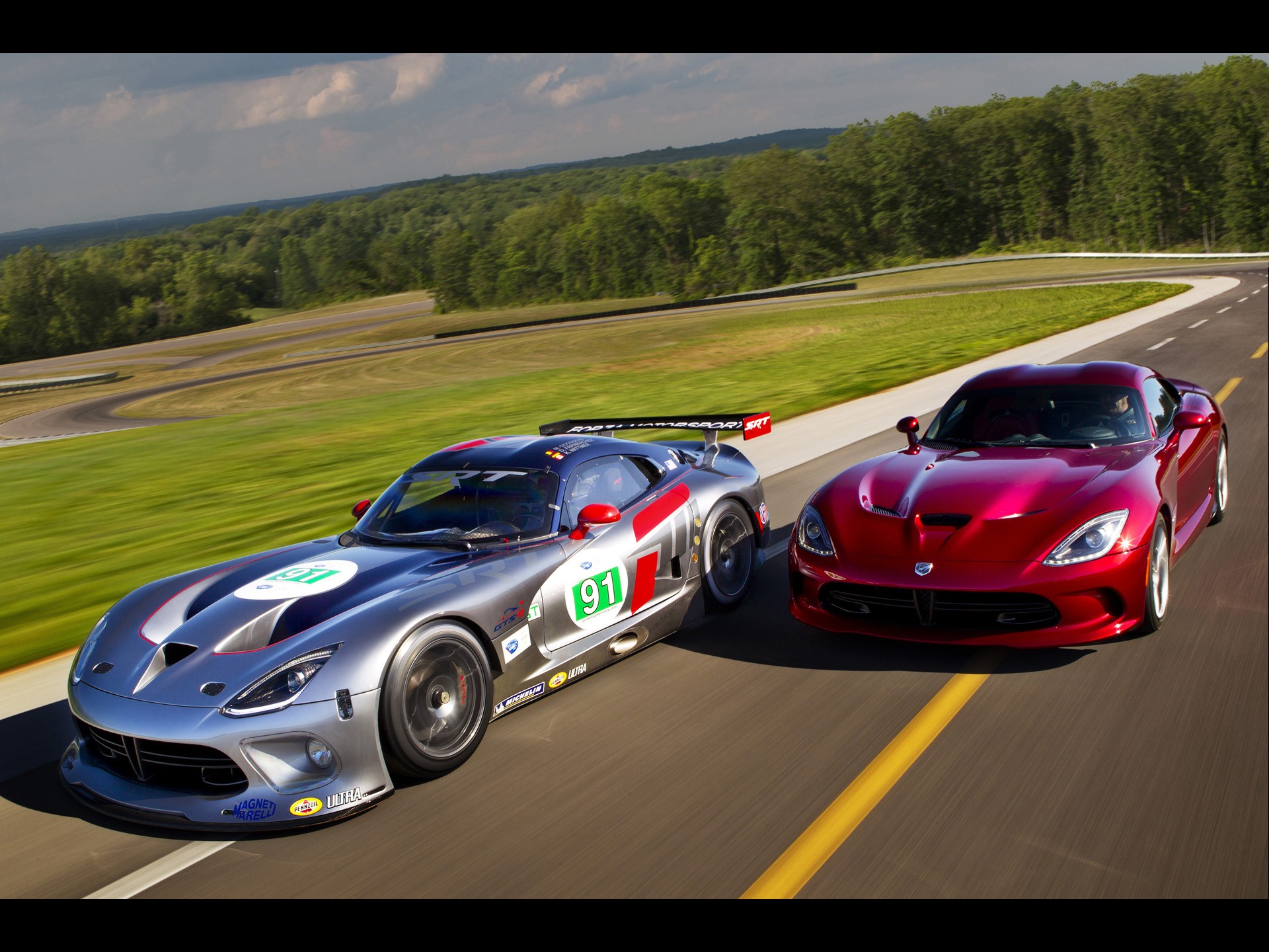 Two Dodge Vipers on a racetrack