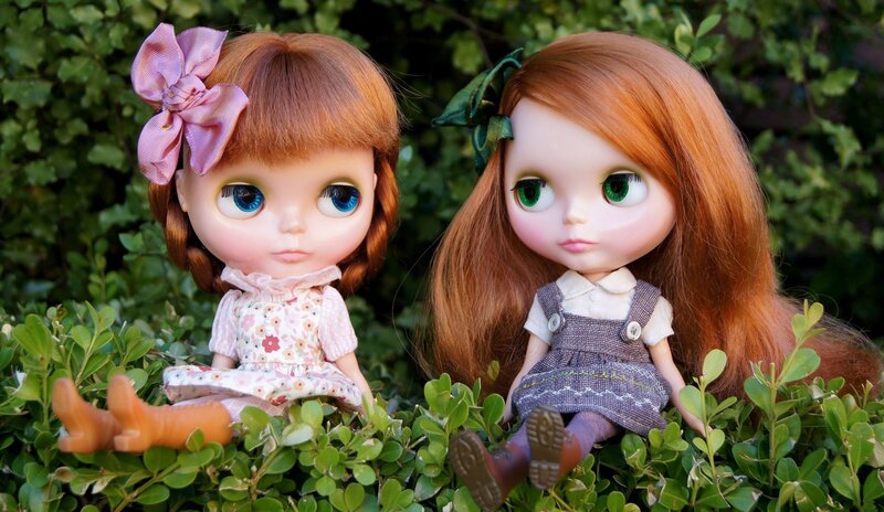 Two Dolls in Bushes