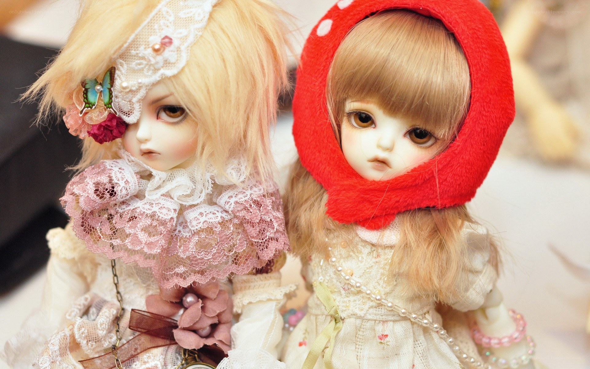 Two dolls in elaborate costumes