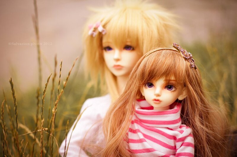 Two Dolls in Grass