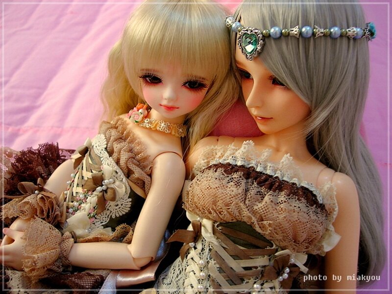 Two Dolls in Lace Dresses