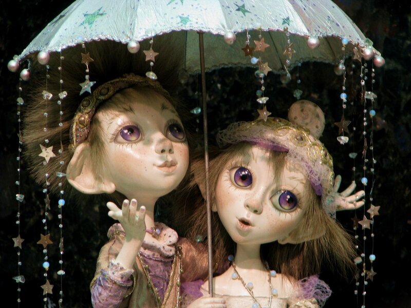 Two Dolls under Umbrella
