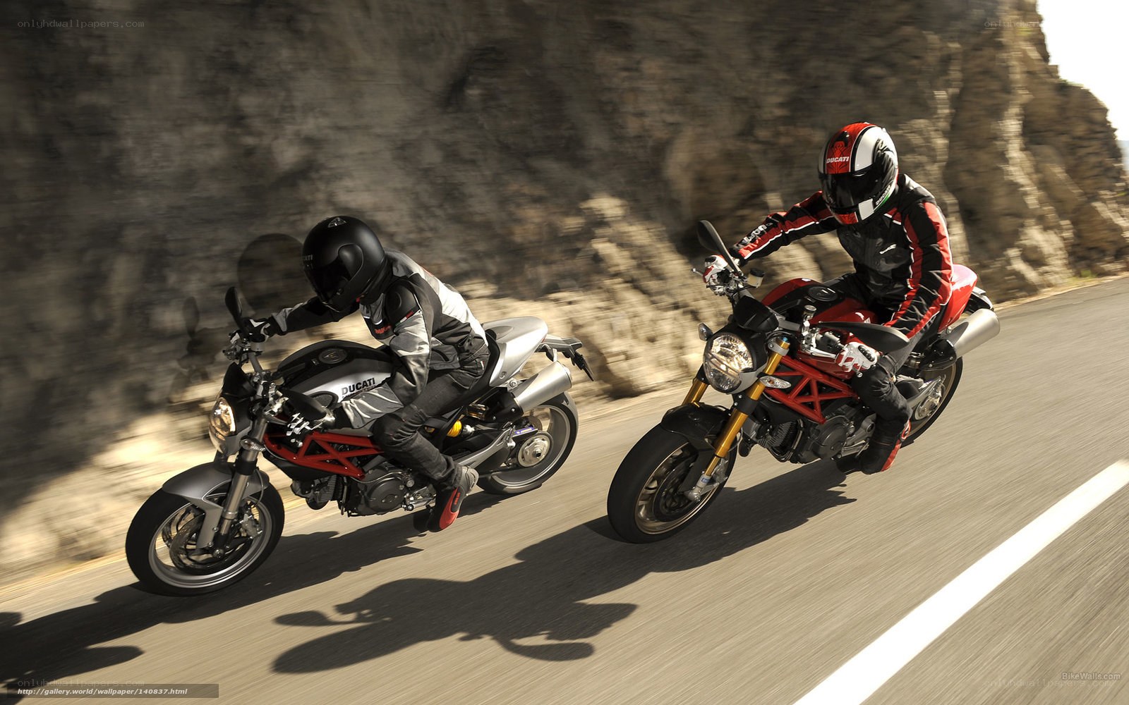 Two Ducati motorcycles on a road
