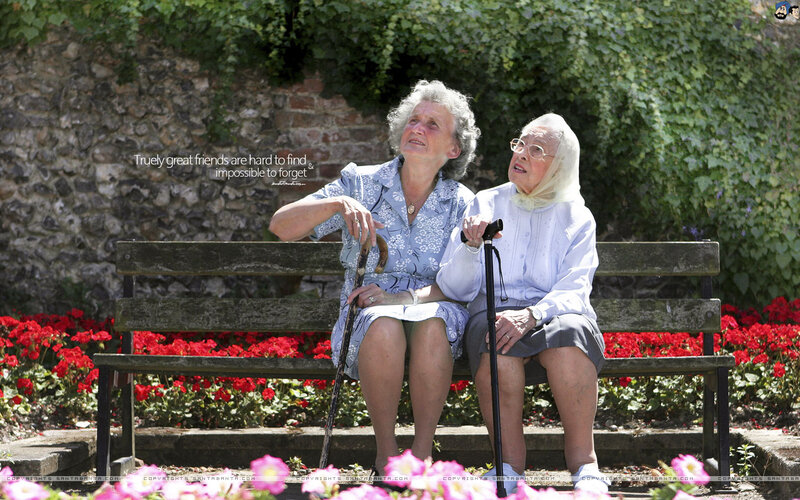 Two Elderly Women on Bench — Red