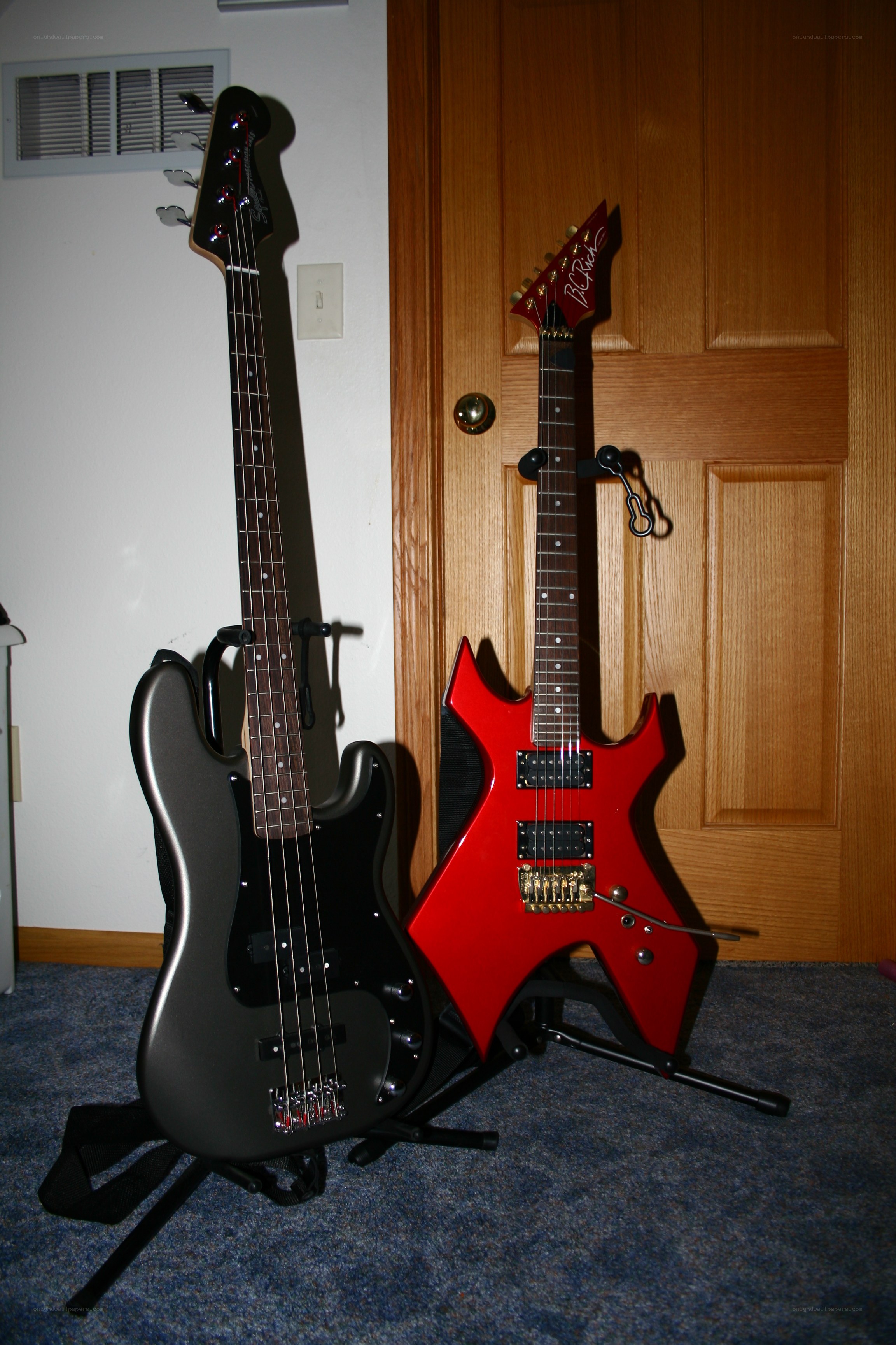 Two electric guitars on stands