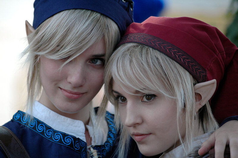 Two elf cosplayers posing together