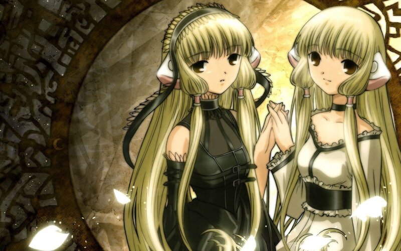 two elf-like girls in contrasting outfits