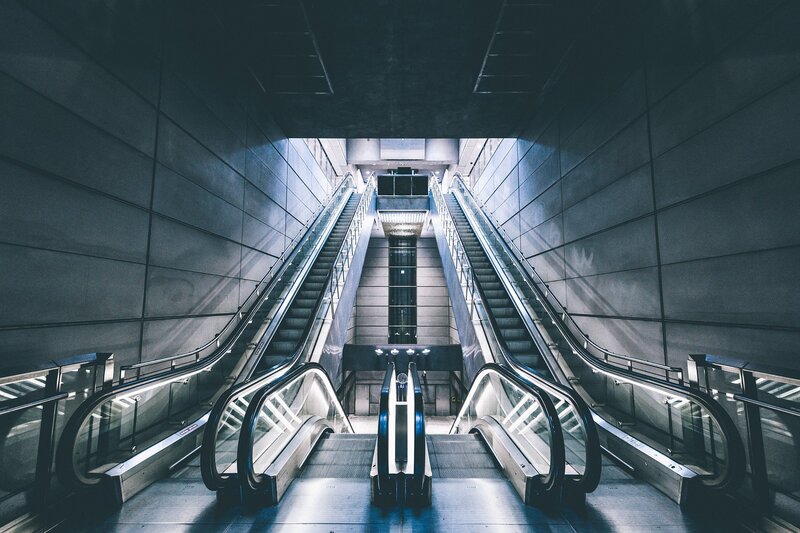 Two Escalators in Station — Gray
