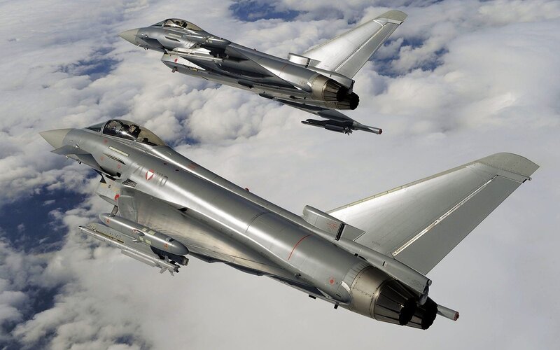 Two Eurofighter jets in flight