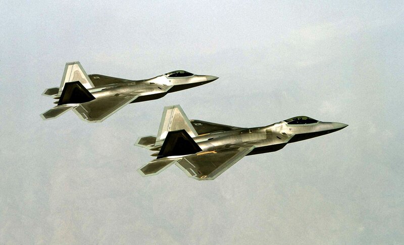 Two F-22 Raptors in flight