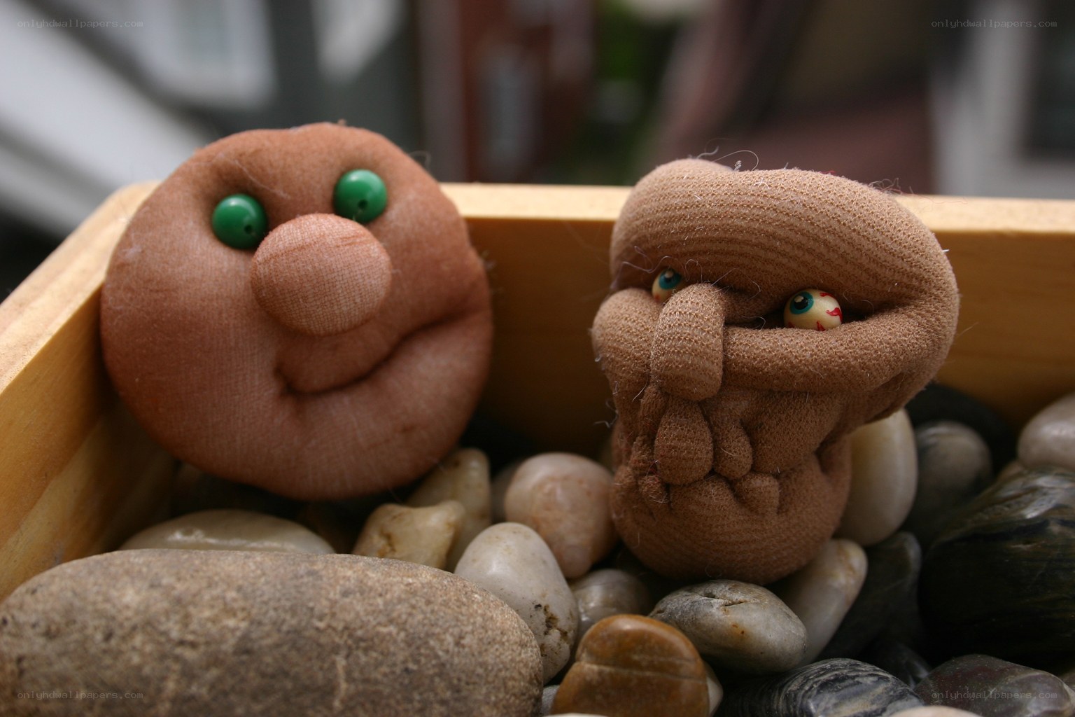Two fabric figures in a box