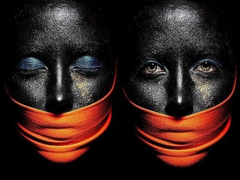 Two Faces with Black Paint