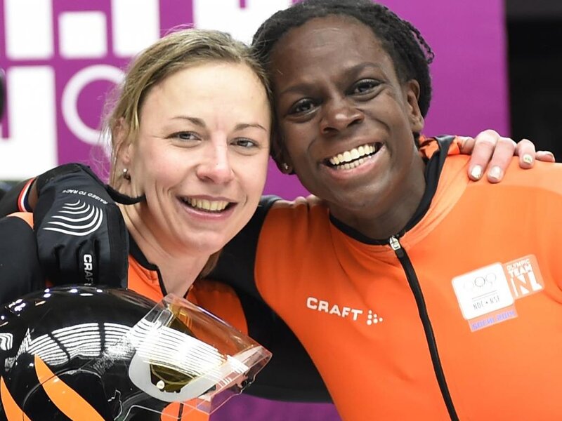 Two Female Athletes — Orange, Happy