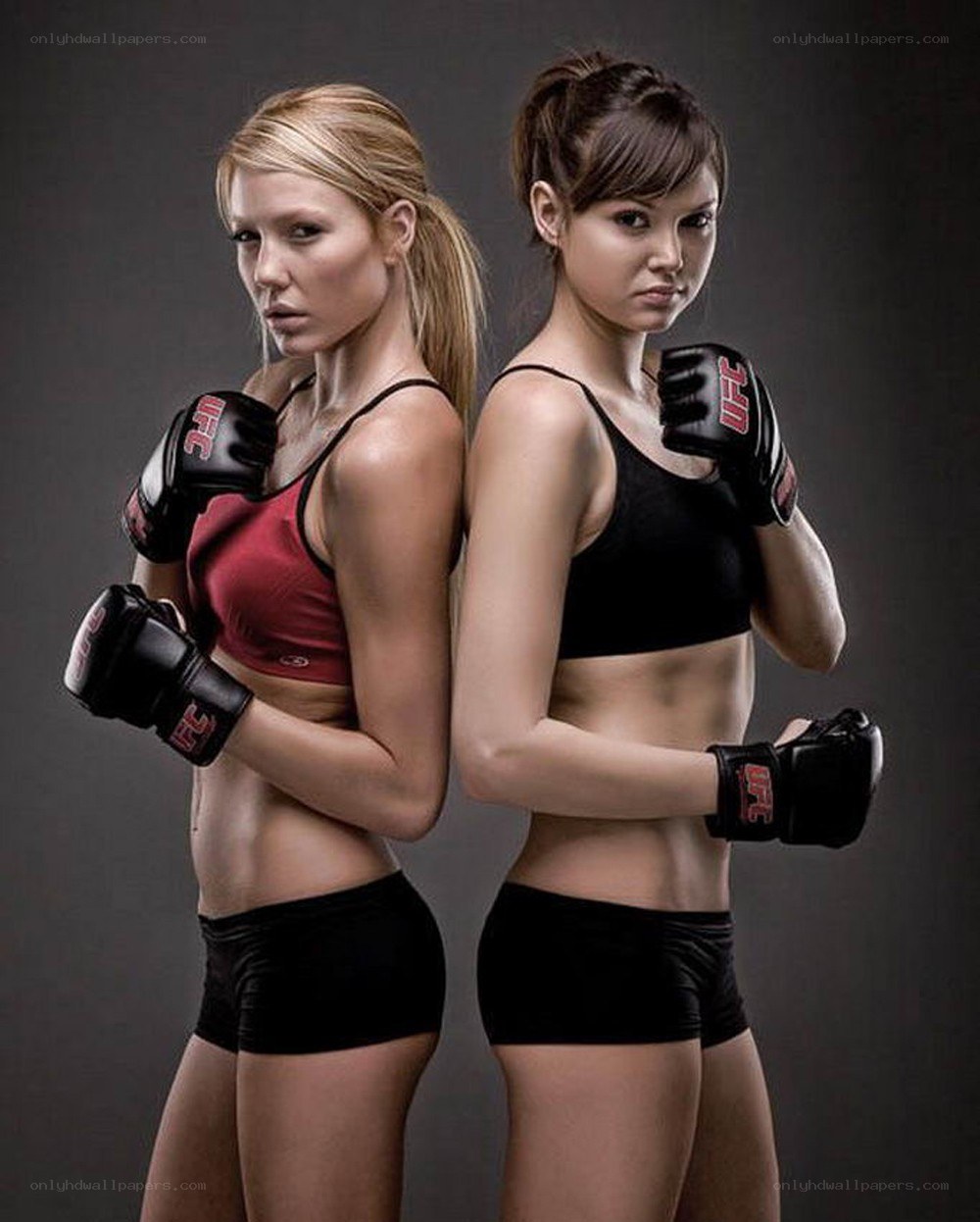 two female fighters in boxing gloves