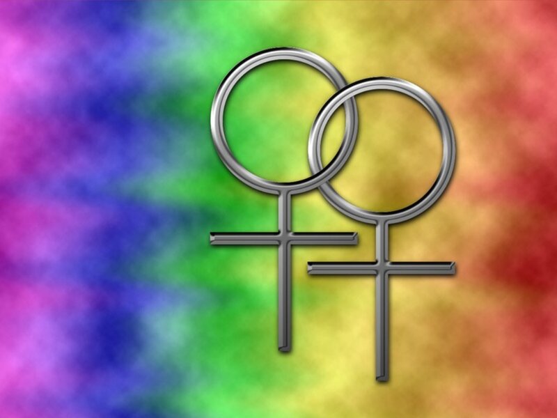 two female symbols on rainbow background