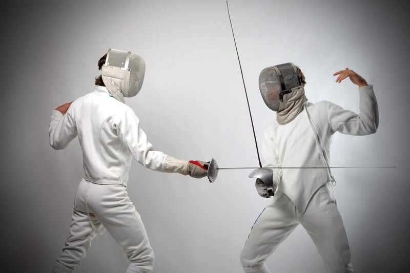 Two fencers in action