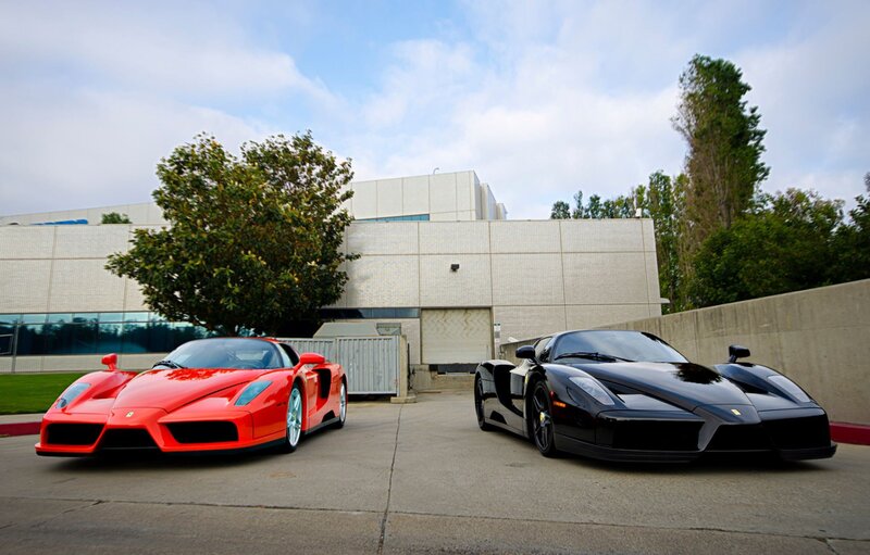 Two Ferrari Enzo cars parked