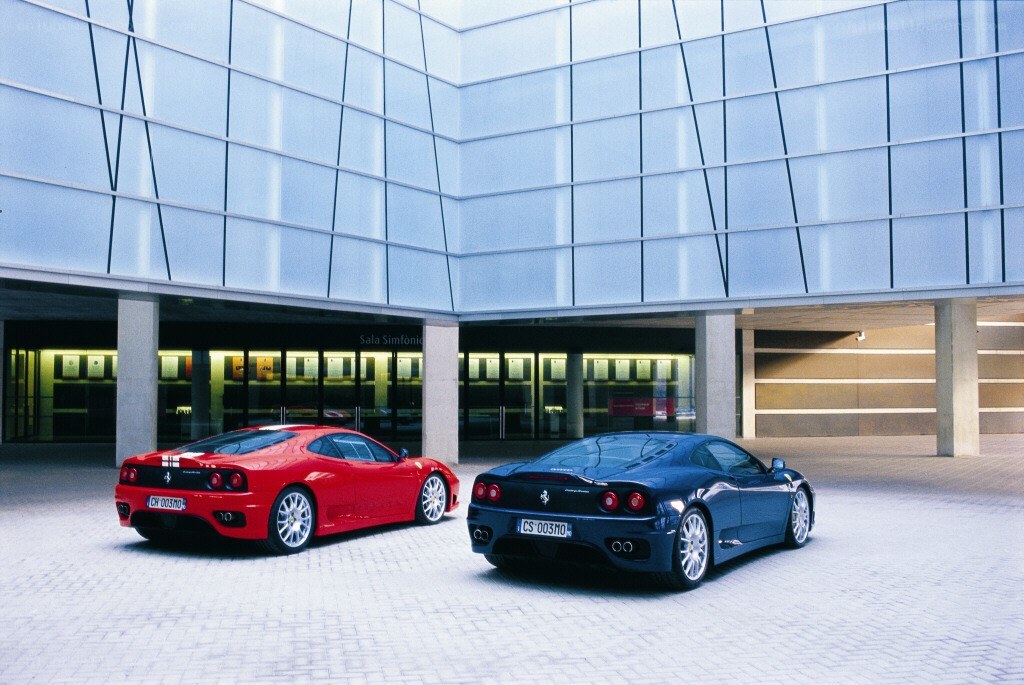 Two Ferraris in a courtyard