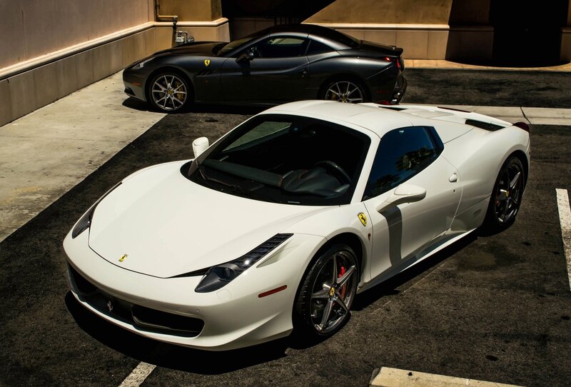 Two Ferraris in a parking lot