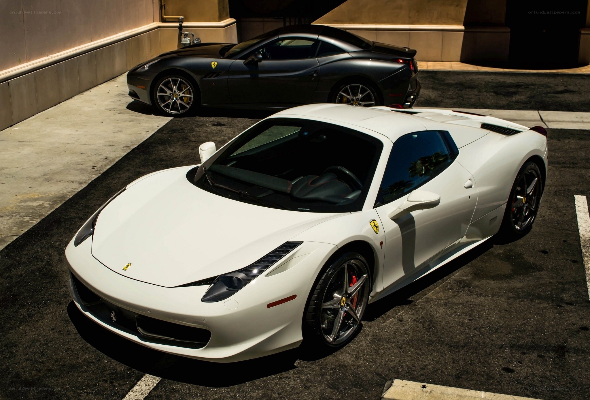 Two Ferraris in a parking lot