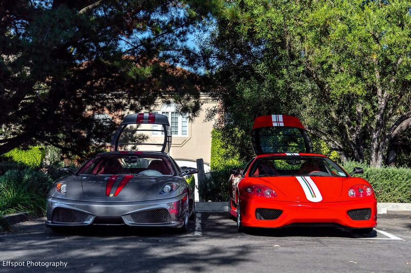 Two Ferraris parked side by side