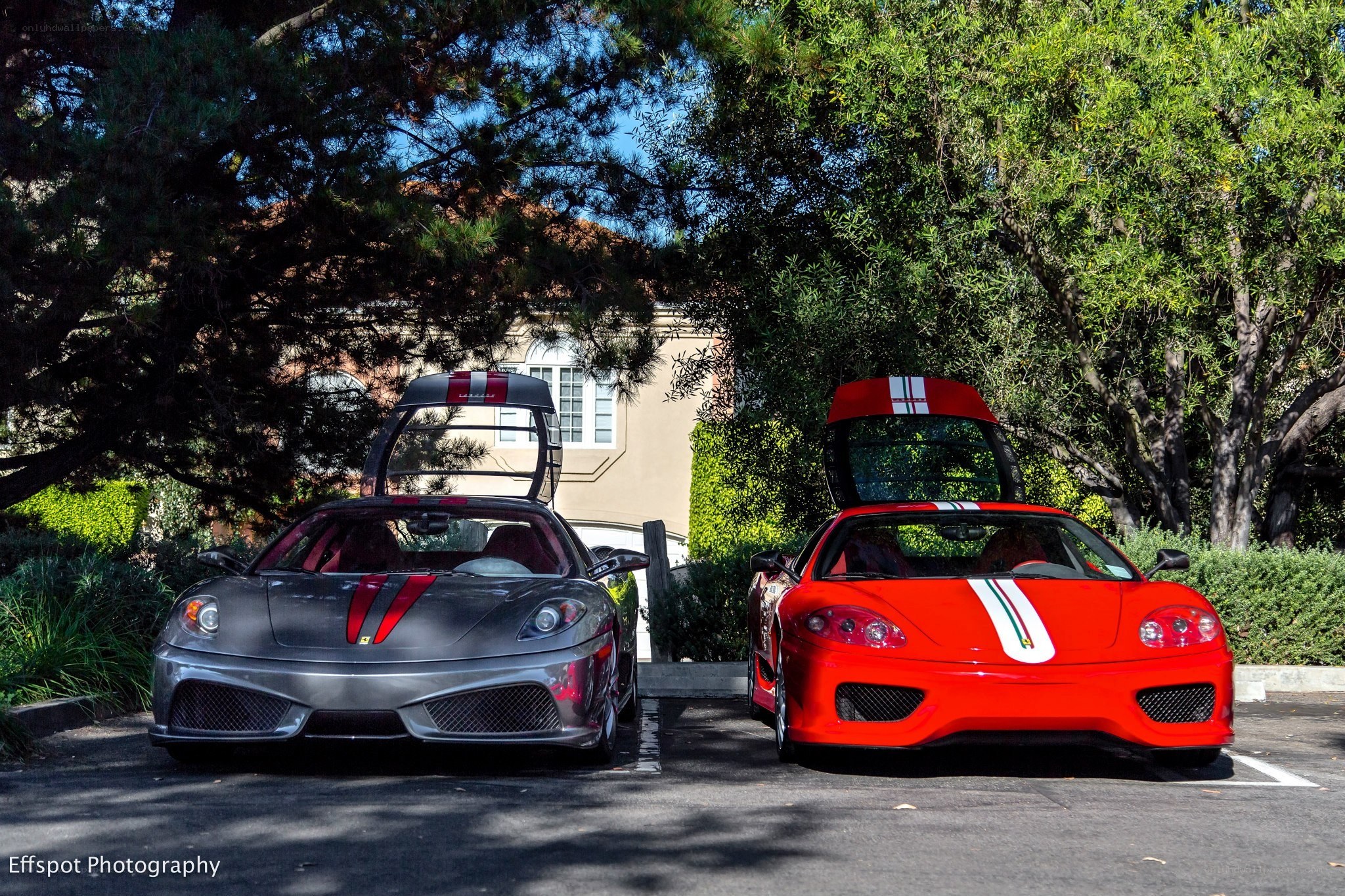 Two Ferraris parked side by side