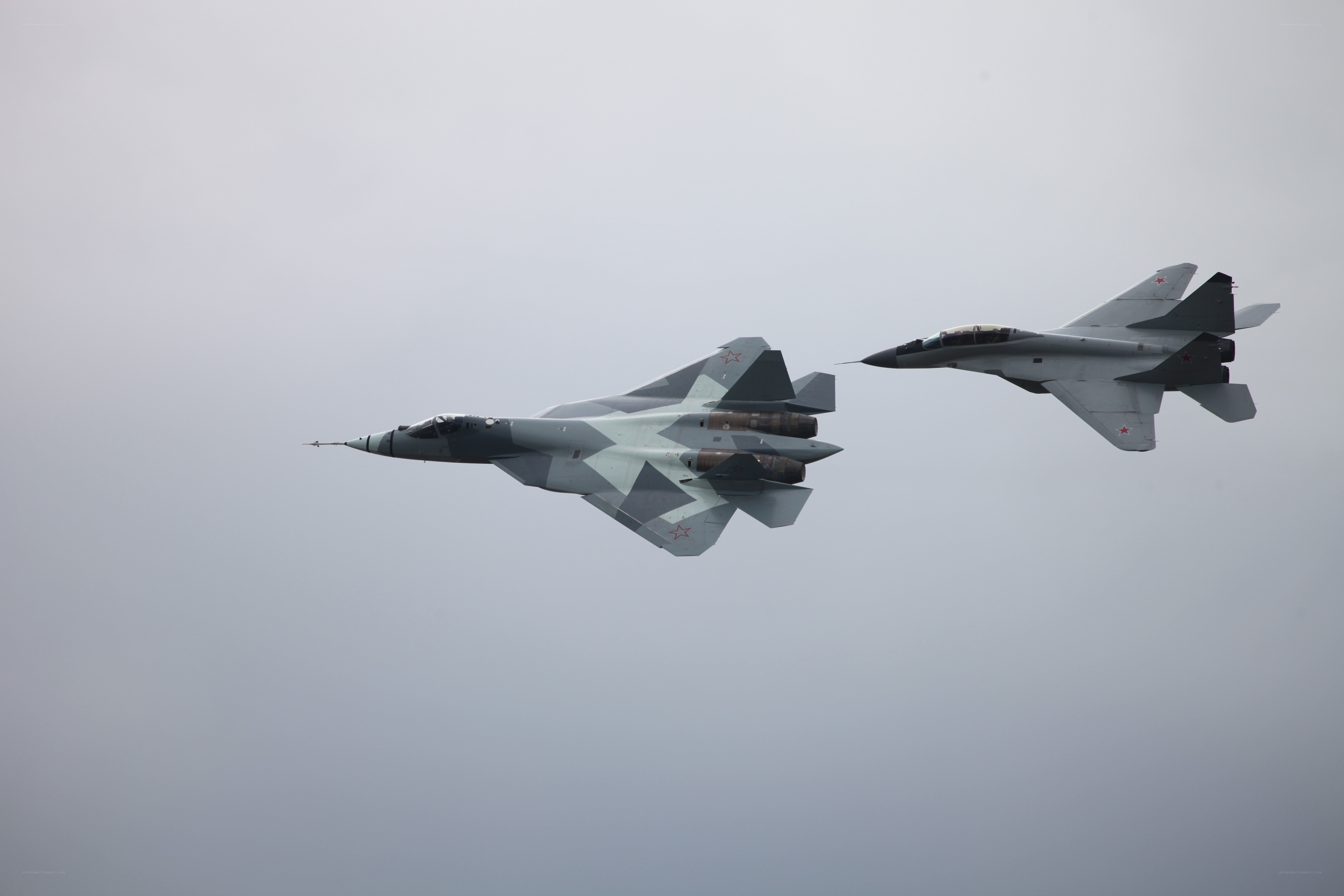 Two fighter jets in flight