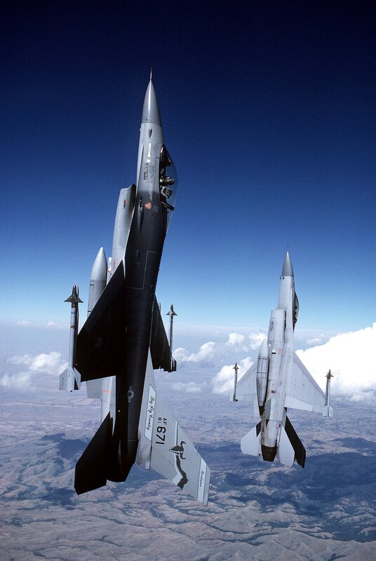 Two Fighter Jets in Flight — Blue, Dramatic, Afternoon, Photograph, Aircraft, Clouds, Sky, Mountains