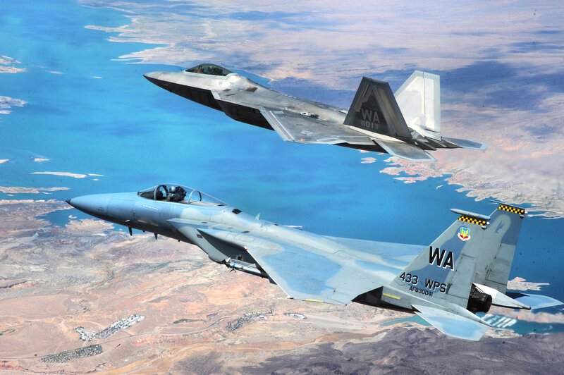 Two Fighter Jets in Flight — Blue, Dynamic, Afternoon, Photograph, Aircraft, Sky, Land