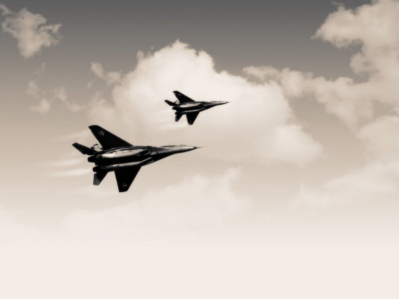 Two Fighter Jets in Flight — Clouds