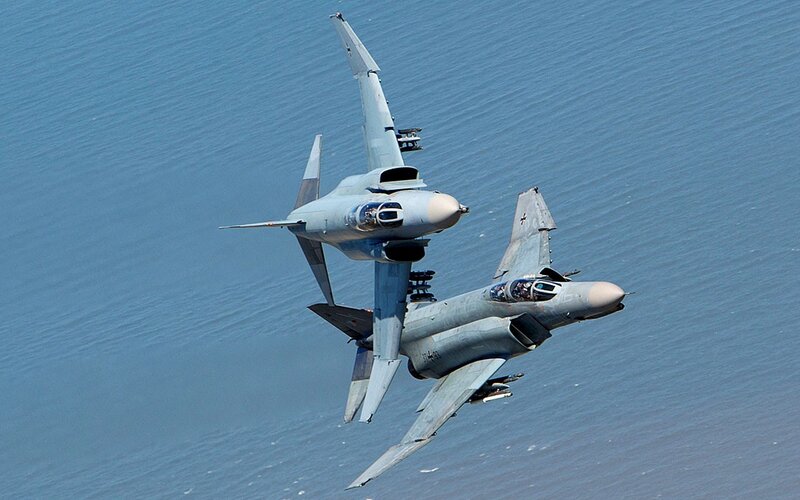 Two Fighter Jets in Flight — Gray, Dynamic, Afternoon, Photograph, Aircraft, Sea