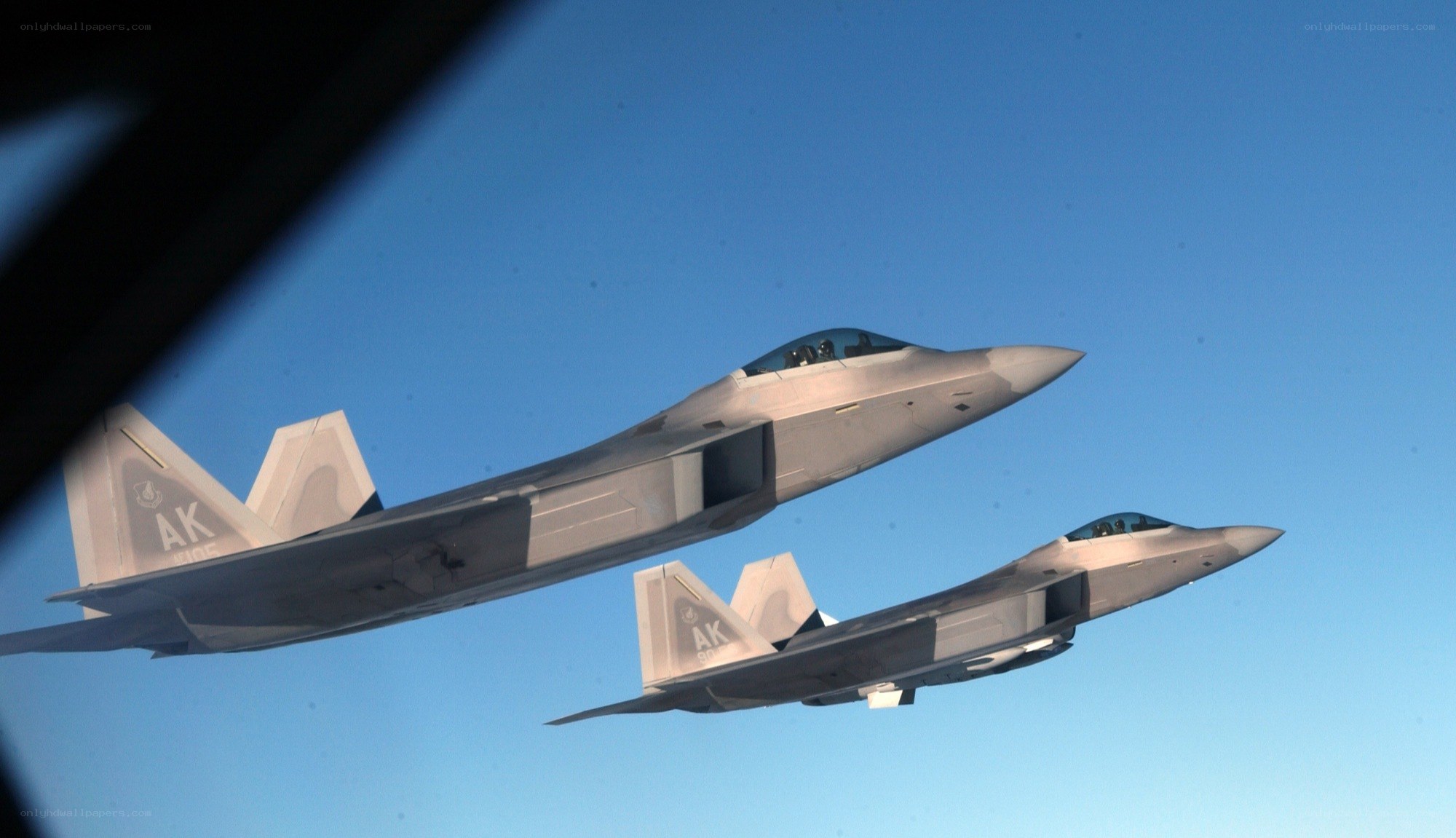 Two fighter jets in formation