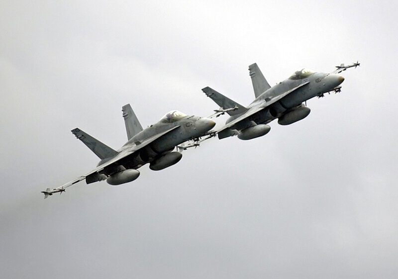 Two fighter jets in formation