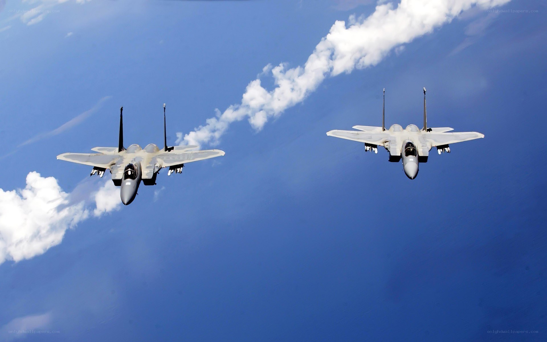 Two fighter jets in formation