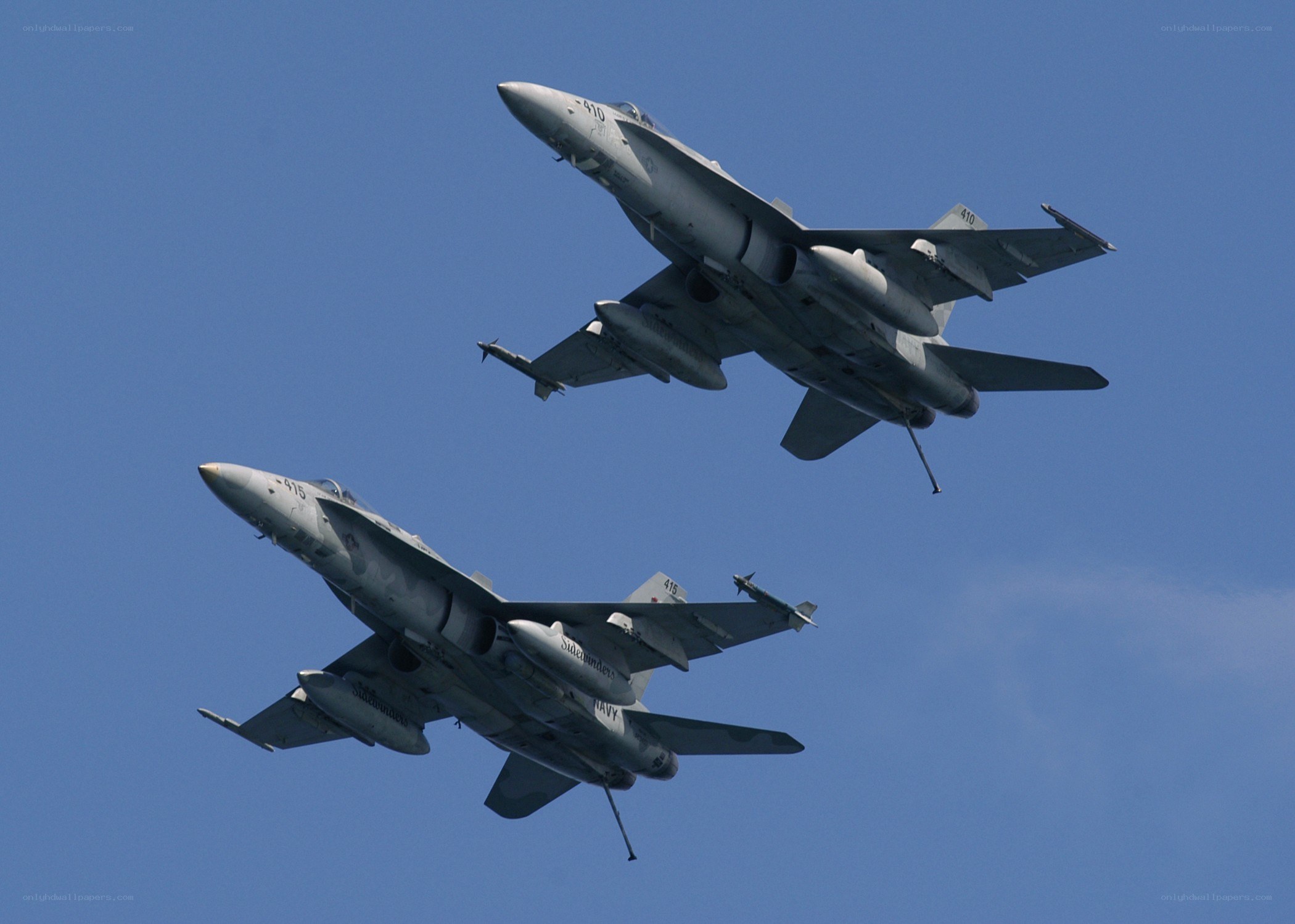 Two fighter jets in formation
