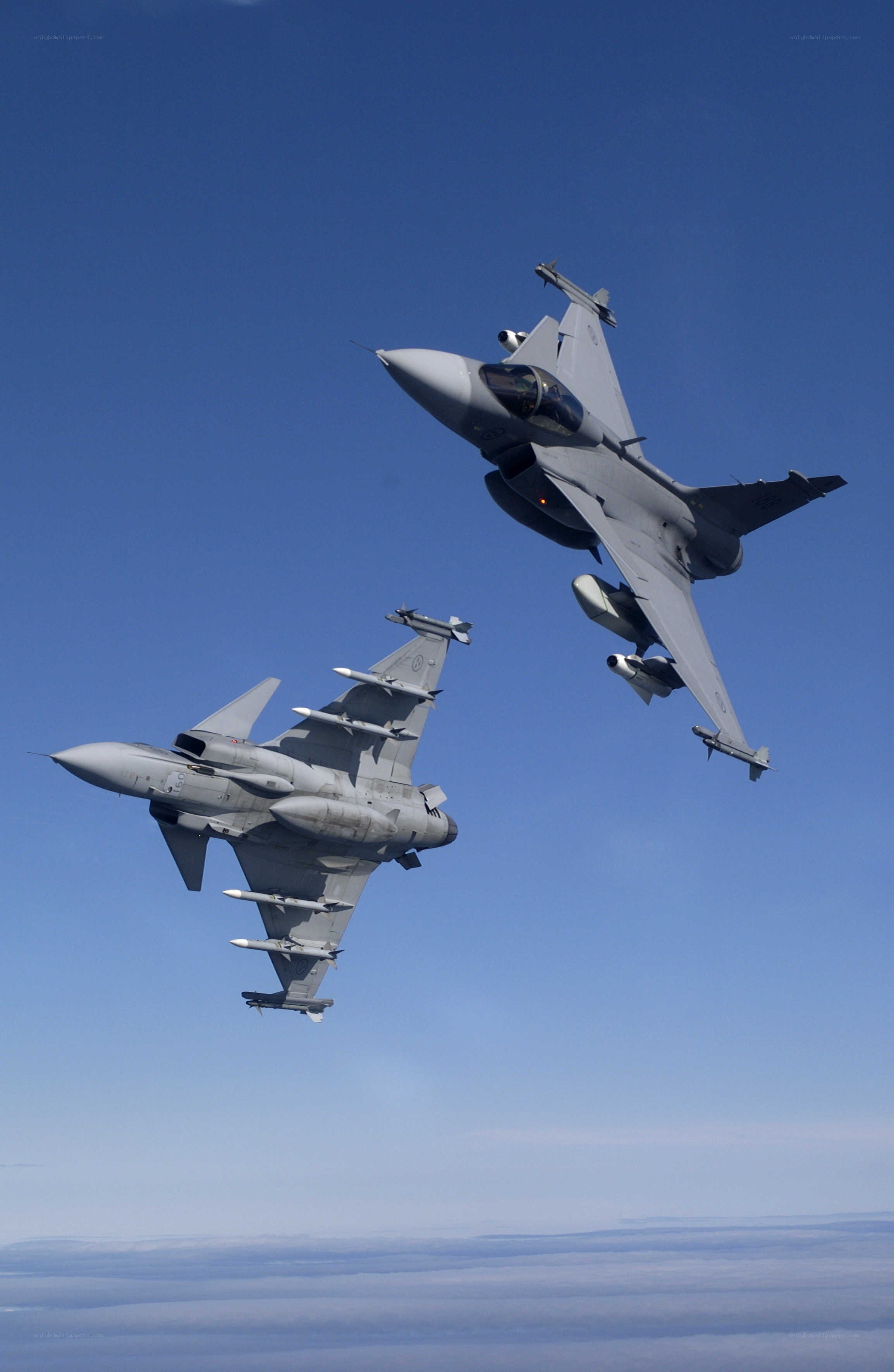 Two fighter jets in formation