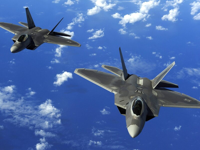 Two fighter jets in formation
