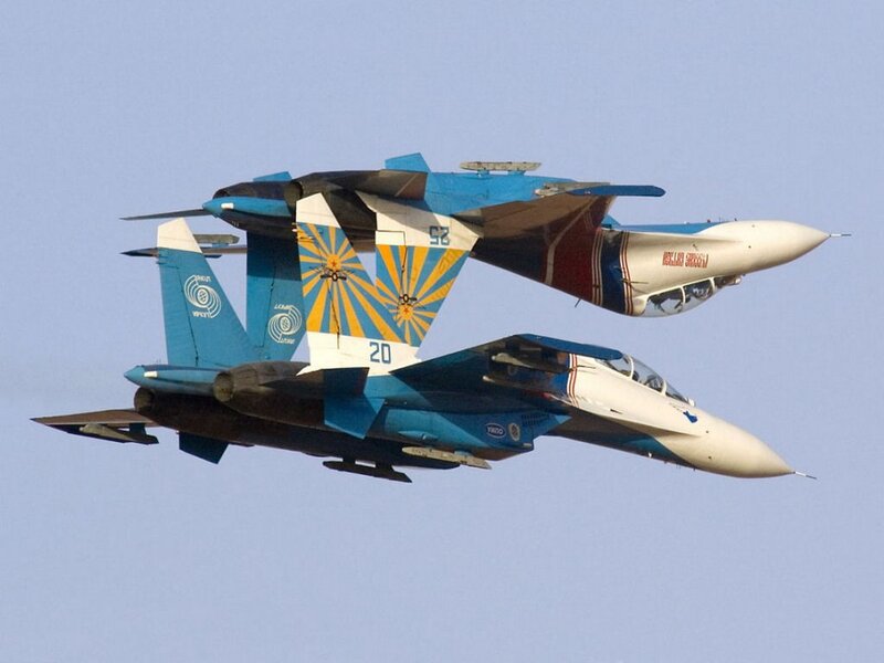 Two Fighter Jets in Formation — Blue, Dynamic, Afternoon, Photograph, Aircraft, Sky, Tail Fins, White