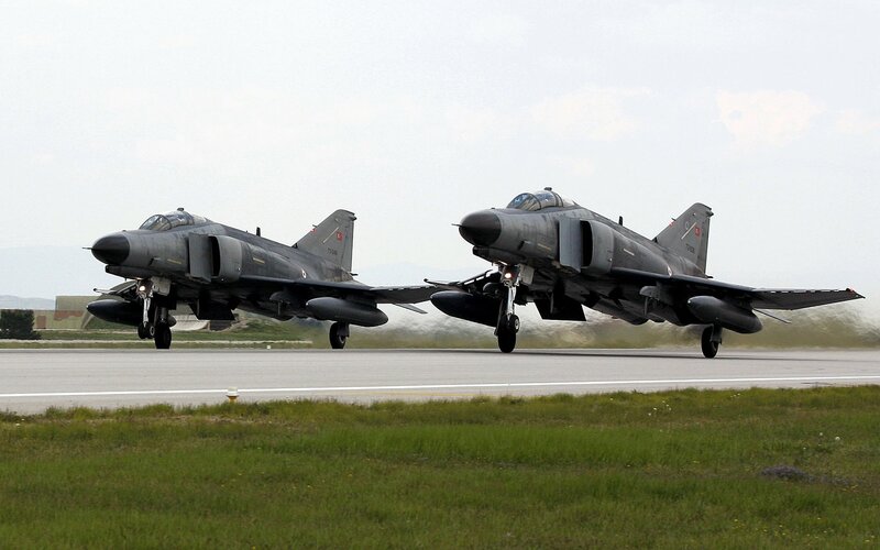 Two fighter jets on runway