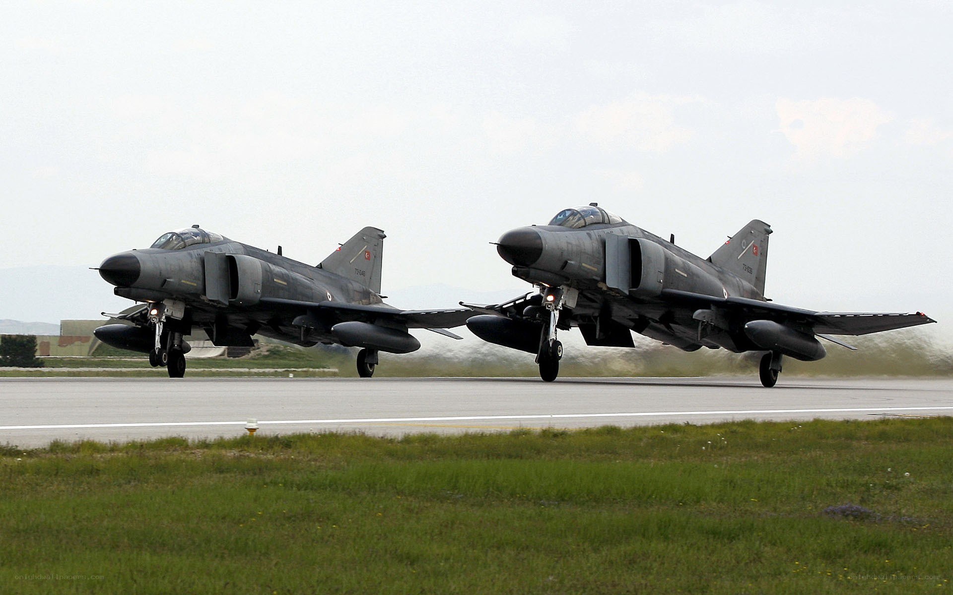 Two fighter jets on runway