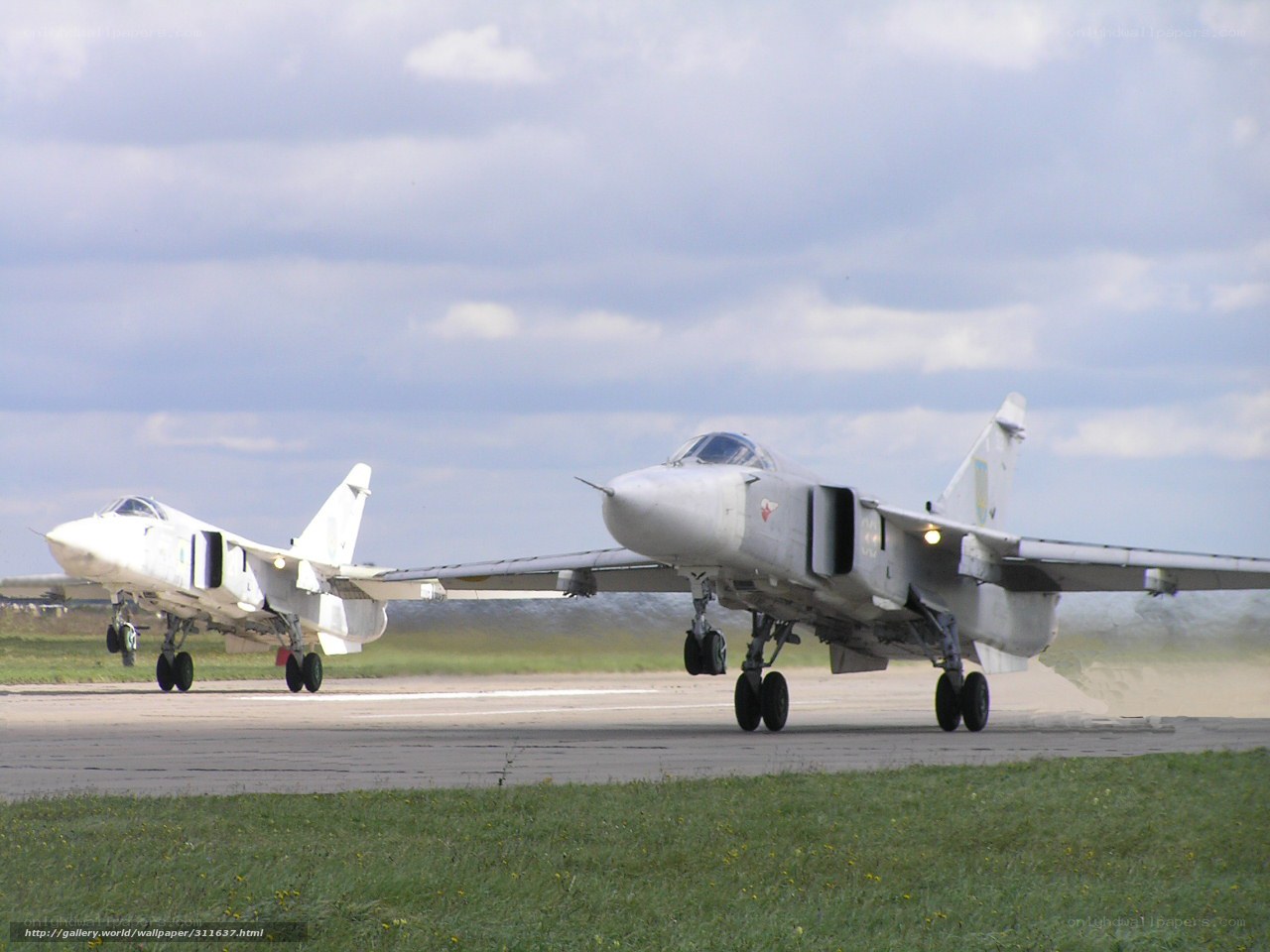 Two fighter jets on runway