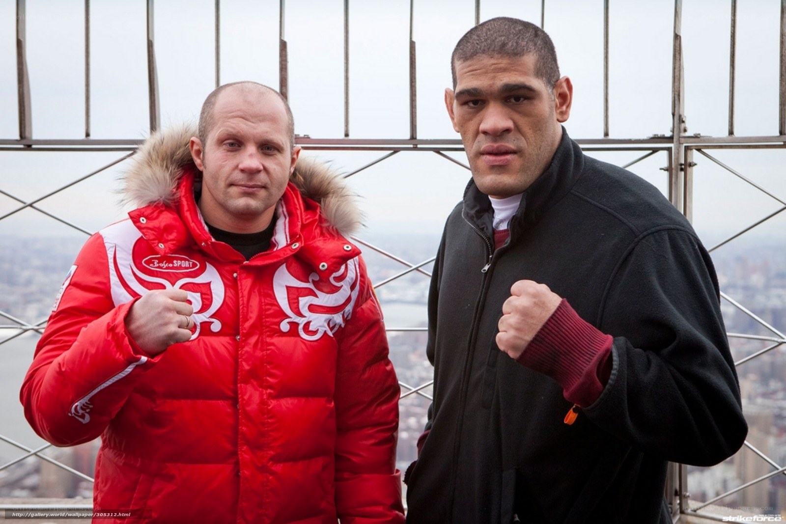 Two fighters pose on a tower