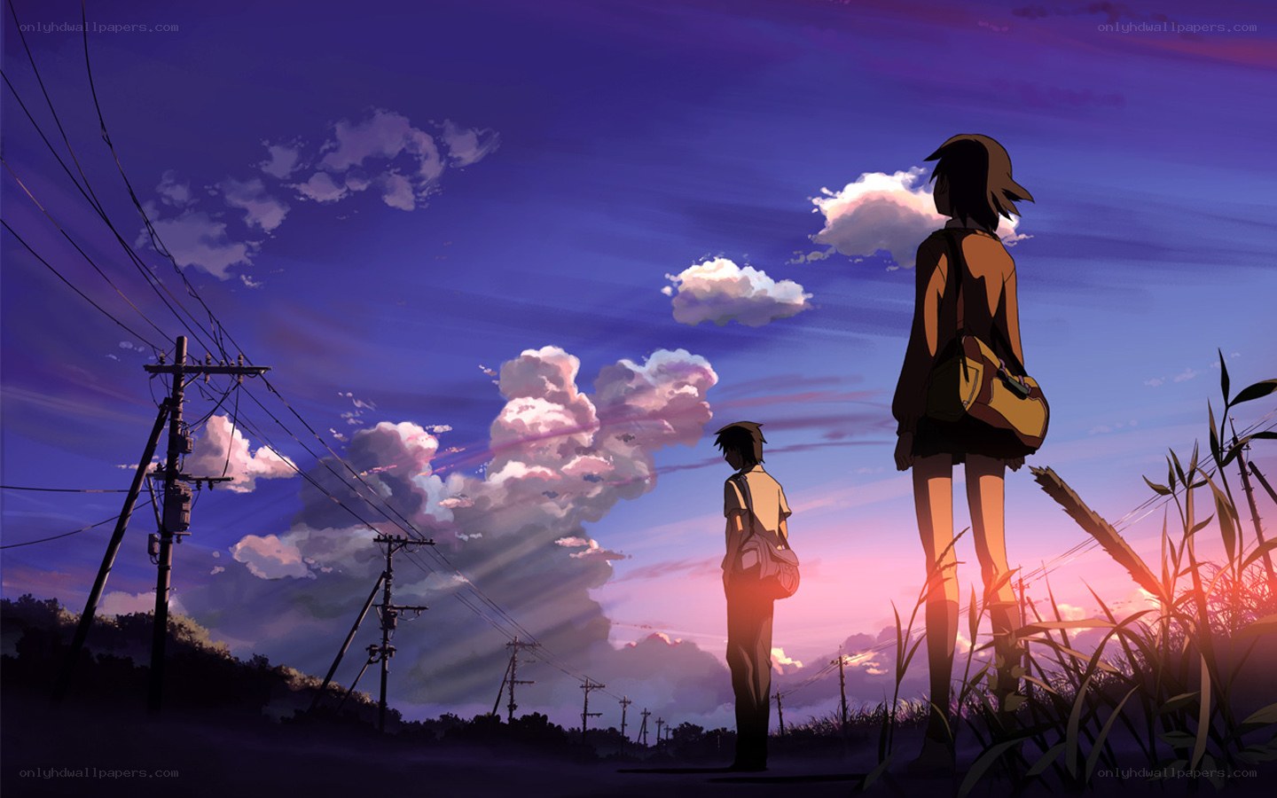 Two figures at sunset