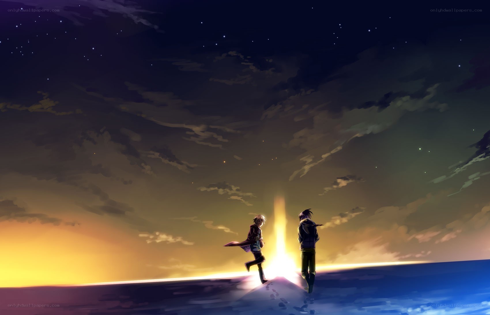 two figures at sunset