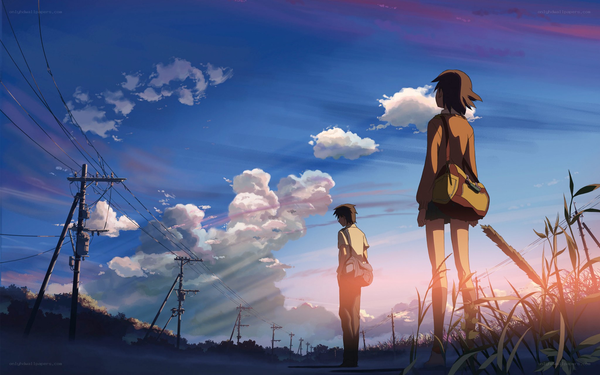 Two figures at sunset