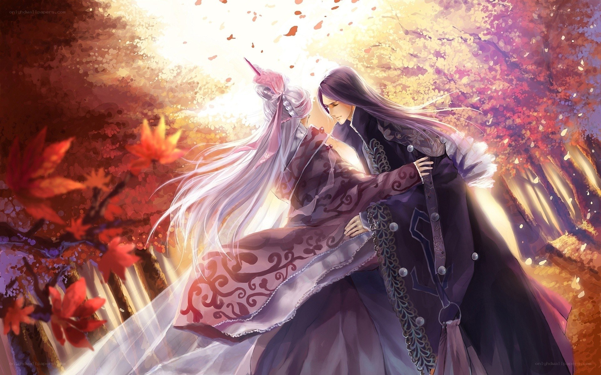 Two figures in autumn embrace