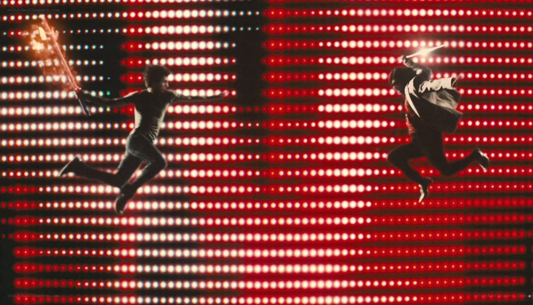 Two figures in combat with lightsabers
