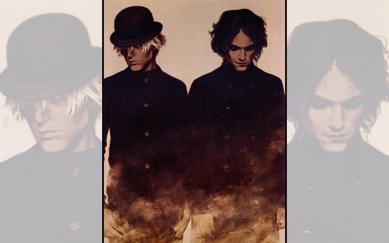 two figures in dark coats