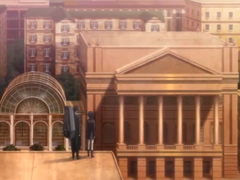 Two Figures in Front of Building